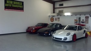 Image: Three porsches in a garage.